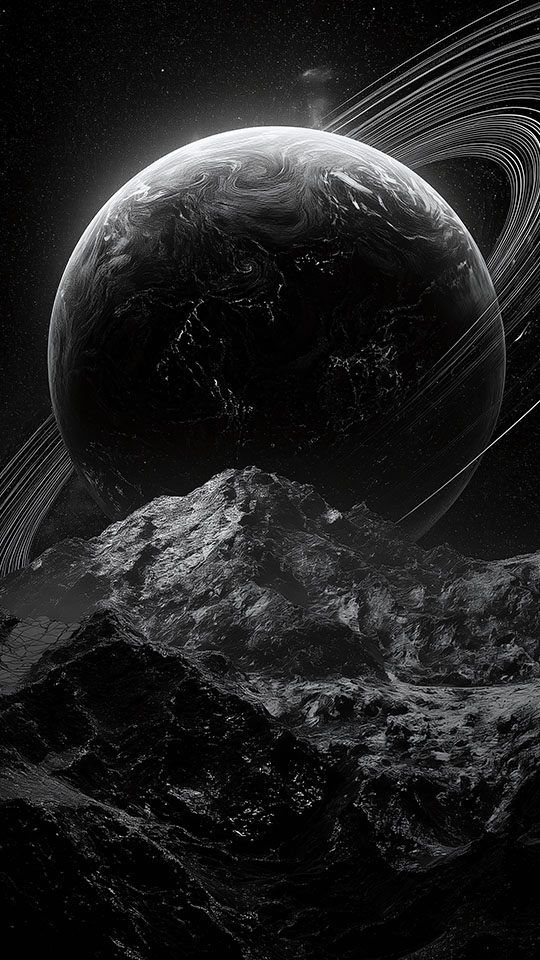 A black and white view of a large ringed planet from the rocky surface of a moon.